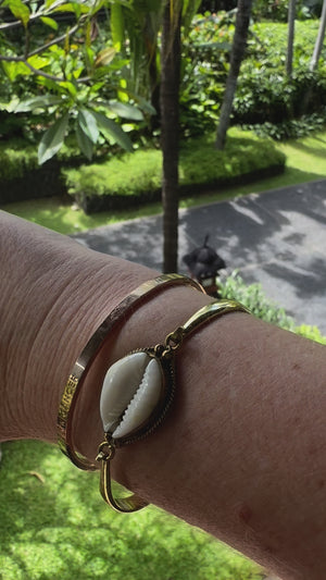 
            
                Load and play video in Gallery viewer, BRASS COWRIE BANGLE
            
        